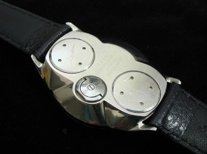 Similar to Accutron 214 & early Timex Electrics having backset hand adjuster but with two battey hatches