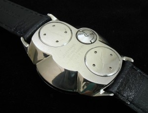 Similar to Accutron 214 & early Timex Electrics having backset hand adjuster but with two battey hatches